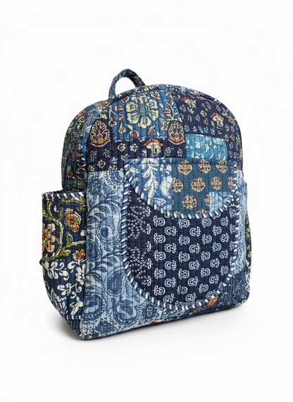 Multicolored fabric bag with floral and abstract patterns on a beige background