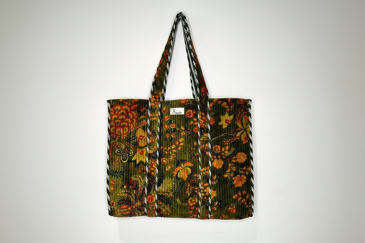 Floral patterned bag with a strap on a white background
