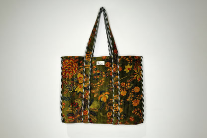 Floral patterned bag with a strap on a white background